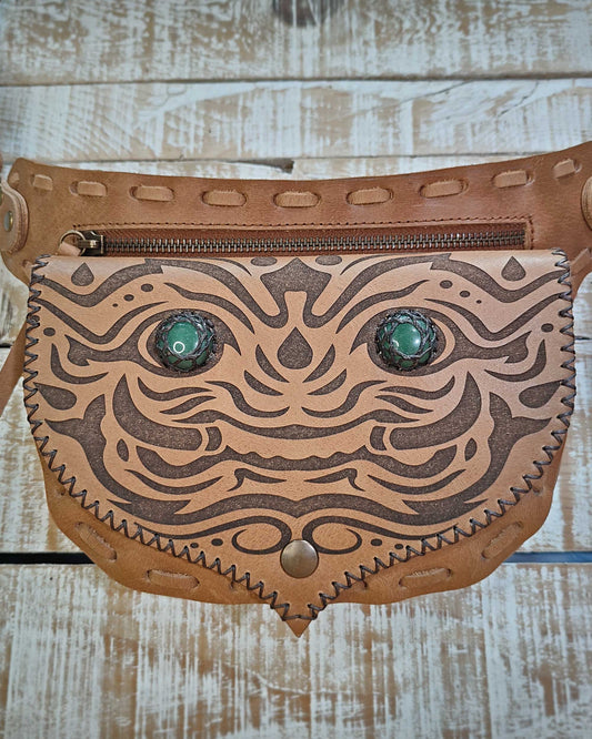Bohonito tan leather belt bag with detailed Kirtmukha artwork and healing gemstones.