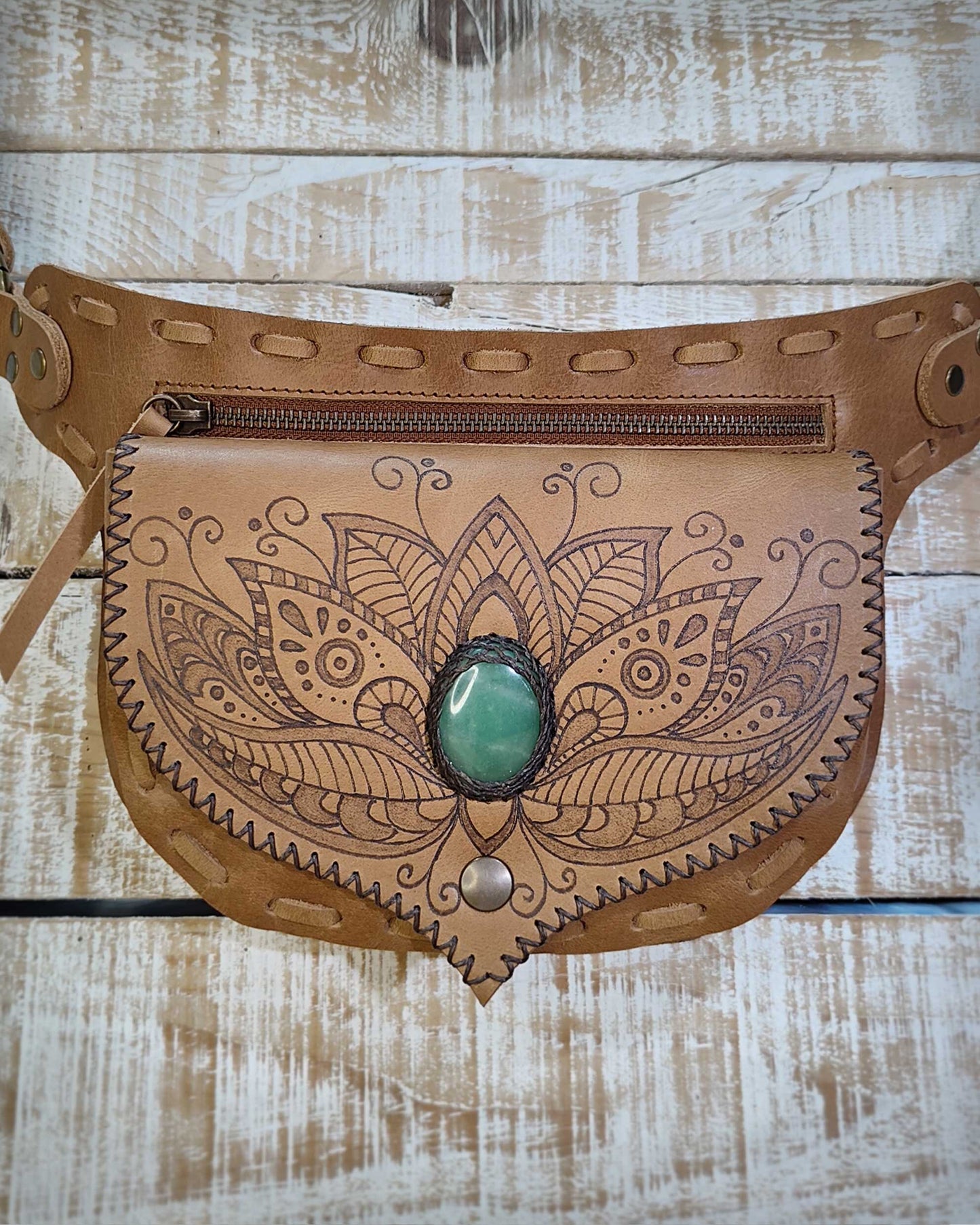 Handmade Bohonito natural oiled leather belt bag with a delicate henna floral pyrography design and green aventurine stone.