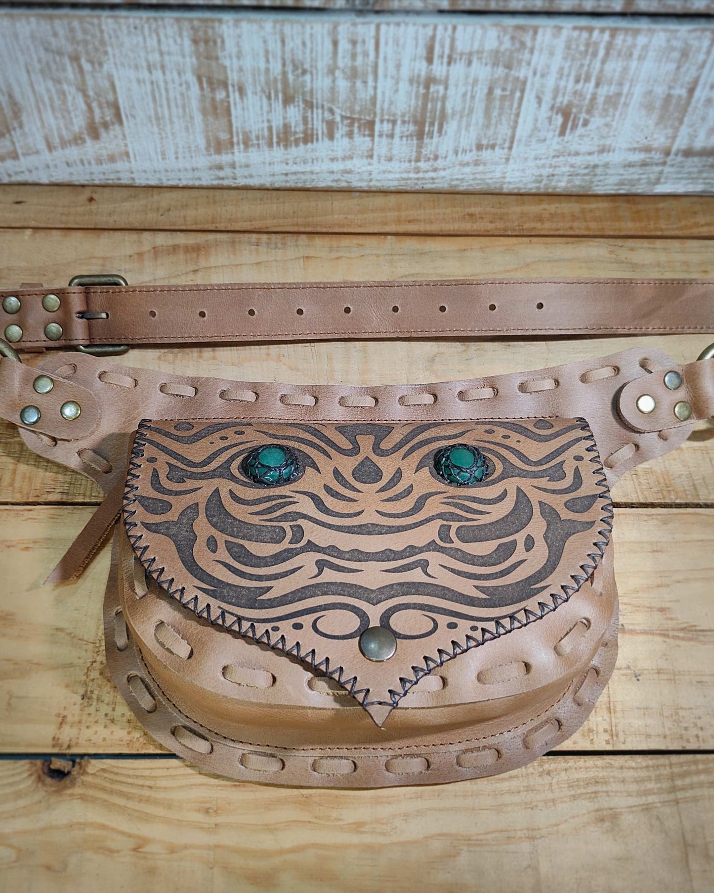 Handmade Bohonito natural leather belt bag with a Kirtmukha engraved design and green aventurine.