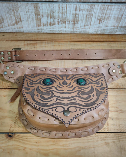 Handmade Bohonito natural leather belt bag with a Kirtmukha engraved design and green aventurine.