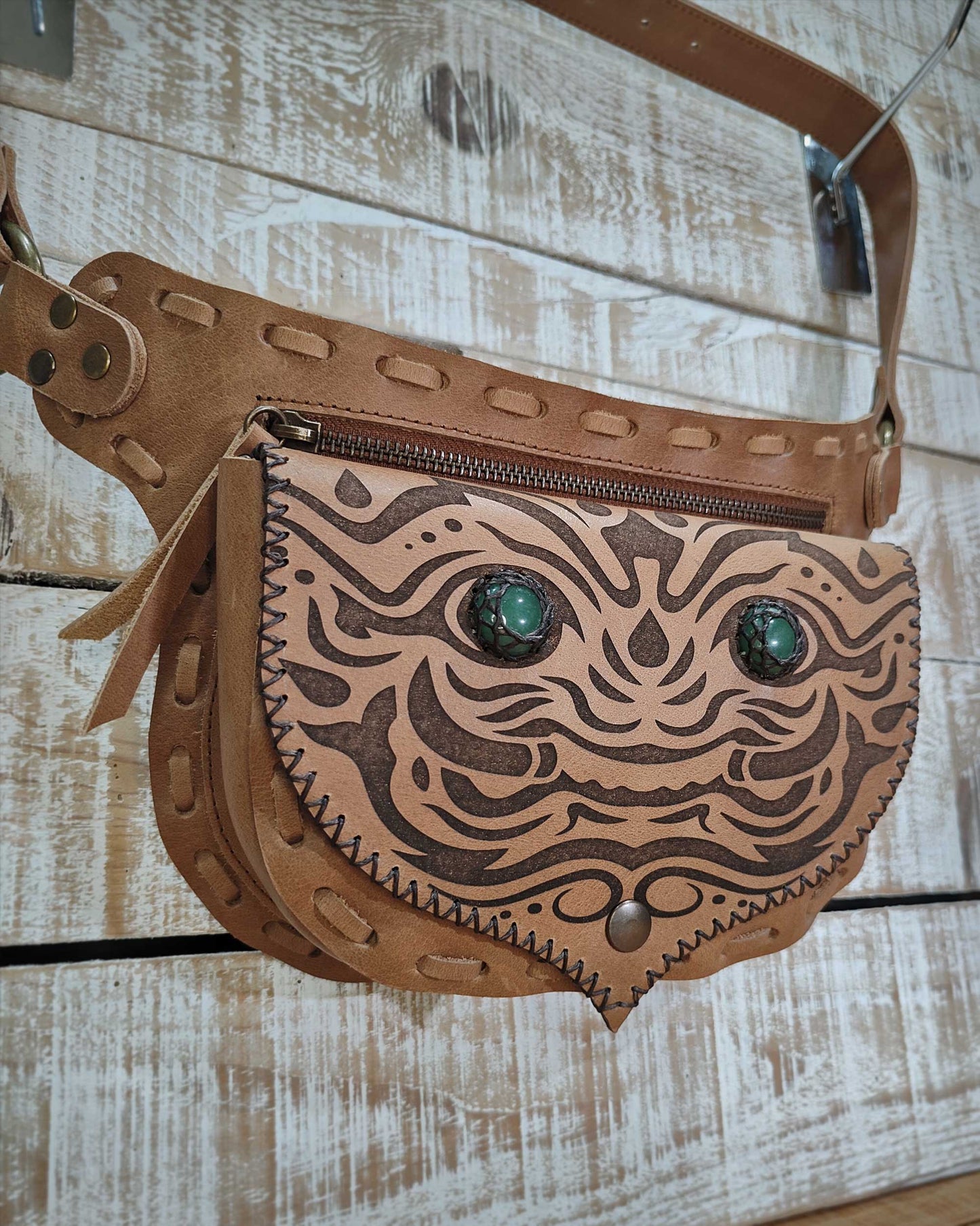 Artisanal tan leather fwaist bag by Bohonito with two protective green aventurine stones and Kirtmukha engraved design.