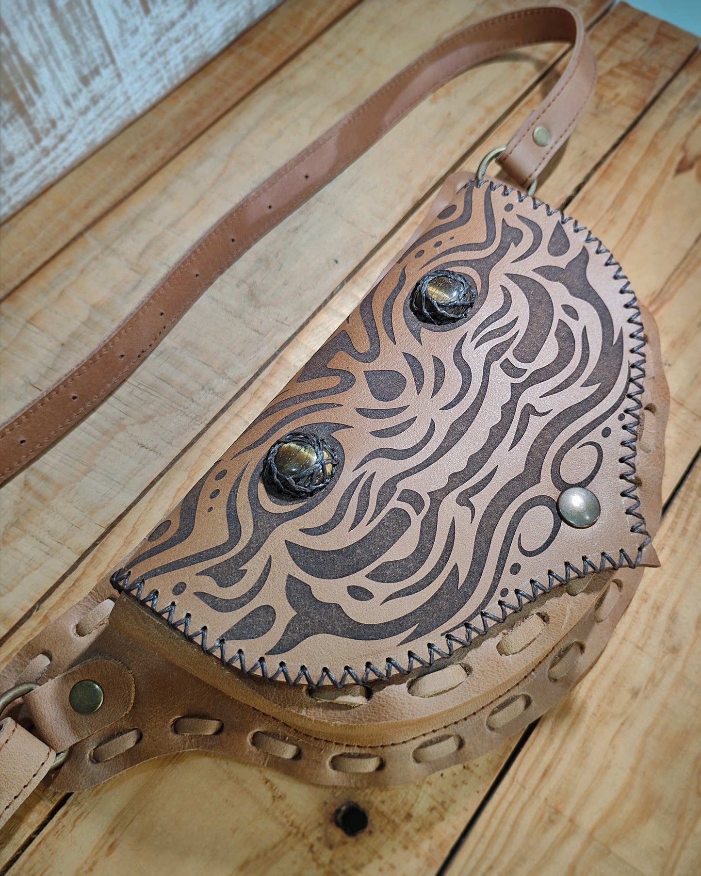 Handmade Bohonito Natural leather belt bag with a Kirtmukha engraved design and tiger eye.