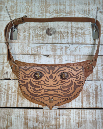 Handcrafted Bohonito leather belt bag featuring an engraved kirtmukha guardian and protective tiger eye side stones.