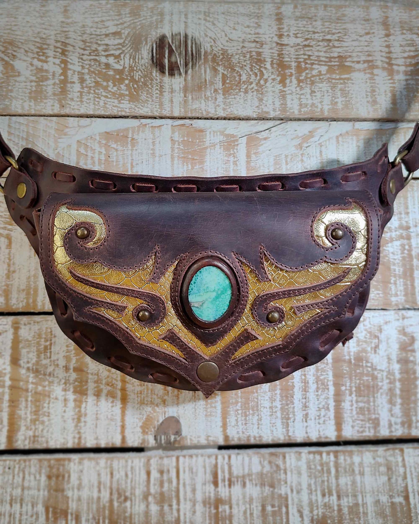 Handmade Bohonito brown leather belt bag with unique tribal artwork and snake skin agate.