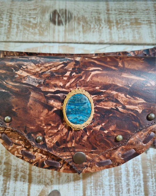 Artisanal brown leather belt bag by Bohonito with a protective blue apatite stone,  secure back pocket and hand-painted.