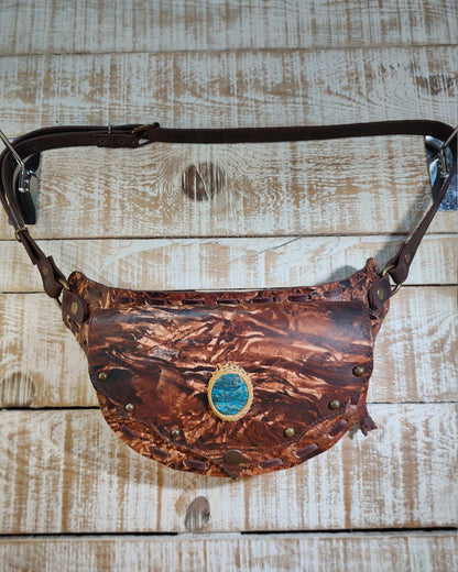 Bohonito brown leather belt bag with hand-painted artwork and a natural apatite healing gemstone.