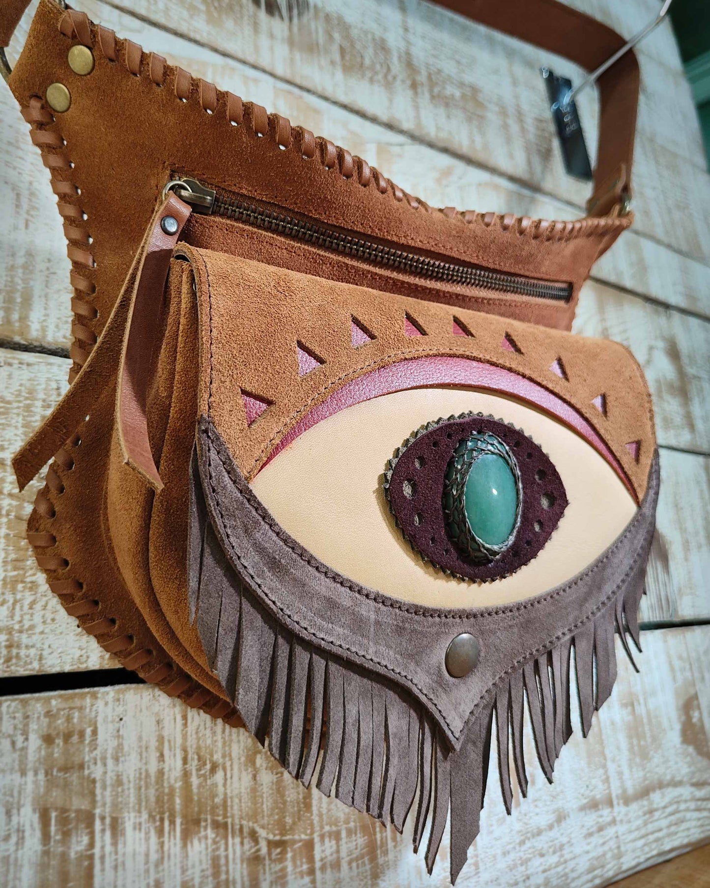 Handcrafted leather hip bag with off-white leather details, third eye Ajna inlay with natural polychrome jasper and artisanal lacing.