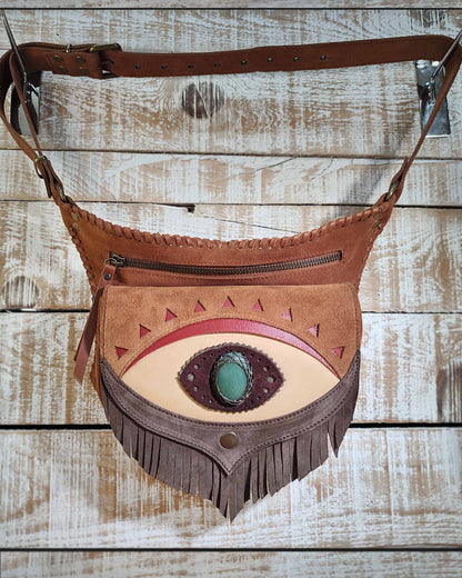 Brown and cream leather waist bag decorated with a polychrome jasper gemstone and hand-stitched leather thonging details.