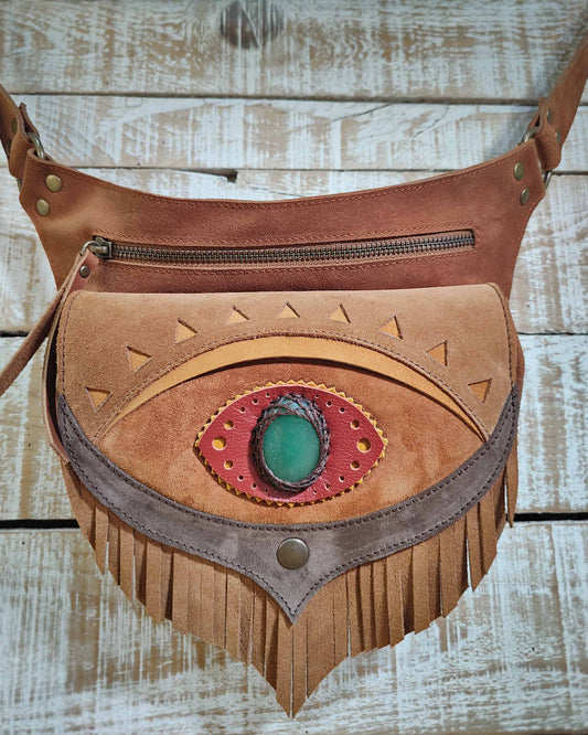 Minimalist waist bag in warm honey and brown leather, featuring a mystical third eye with a polished aventurine gemstone.