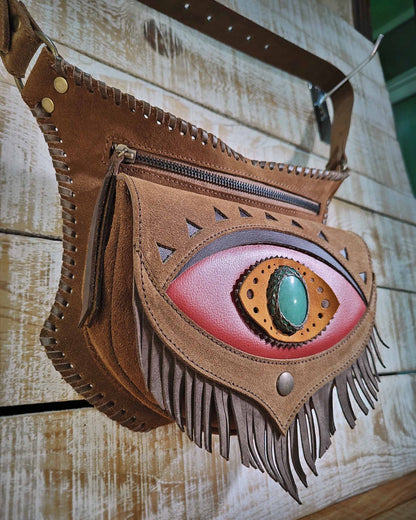Bohonito Leather festival belt bag model Omara with a red fringed flap, featuring an aventurine stone and hand-laced finish.