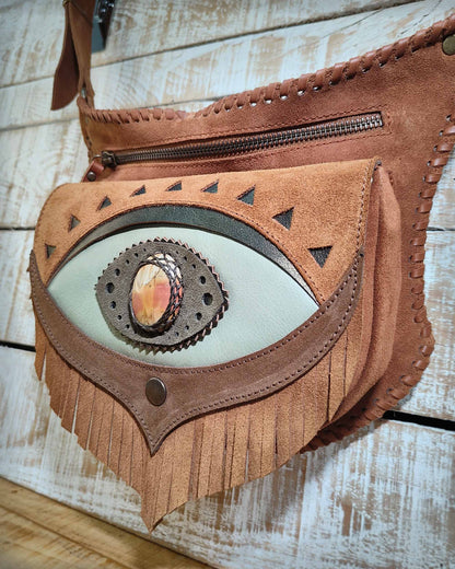 Bohonito Omara brown leather belt bag featuring a seafoam fringe flap, Ajna Chakra design with polychrome  jasper stone, and hand-laced edges.