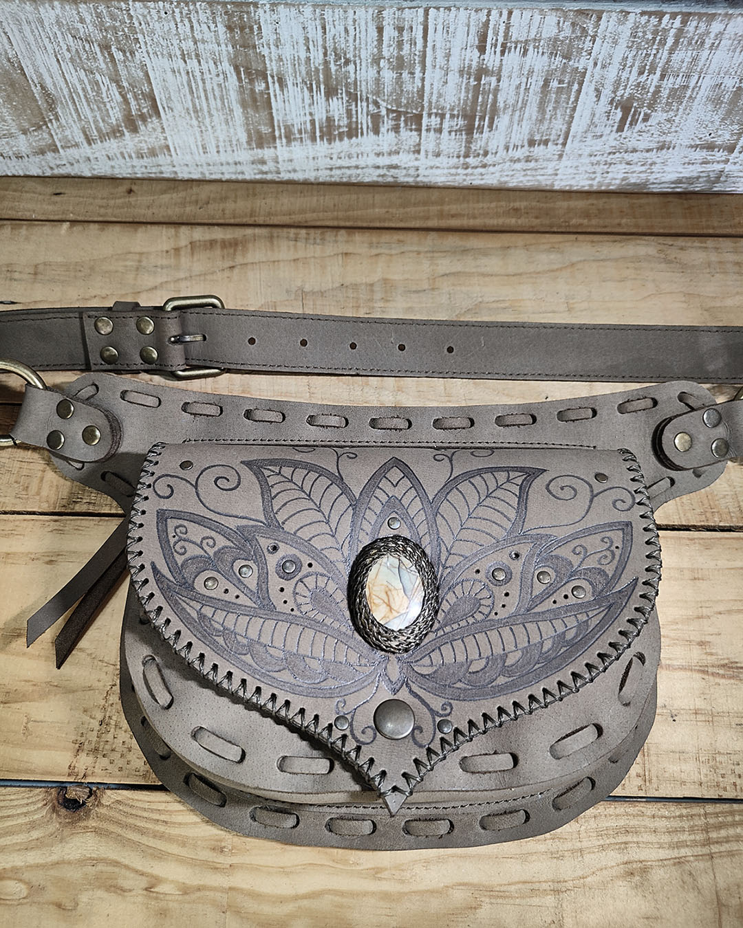 Hand-burned henna floral design on a Kaki leather belt bag featuring a natural Picasso Jasper stone.