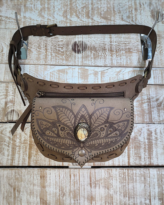 Detailed view of velvety Kaki Nubuck leather on a Bohonito Gautxa belt bag with handcrafted pyrography art.