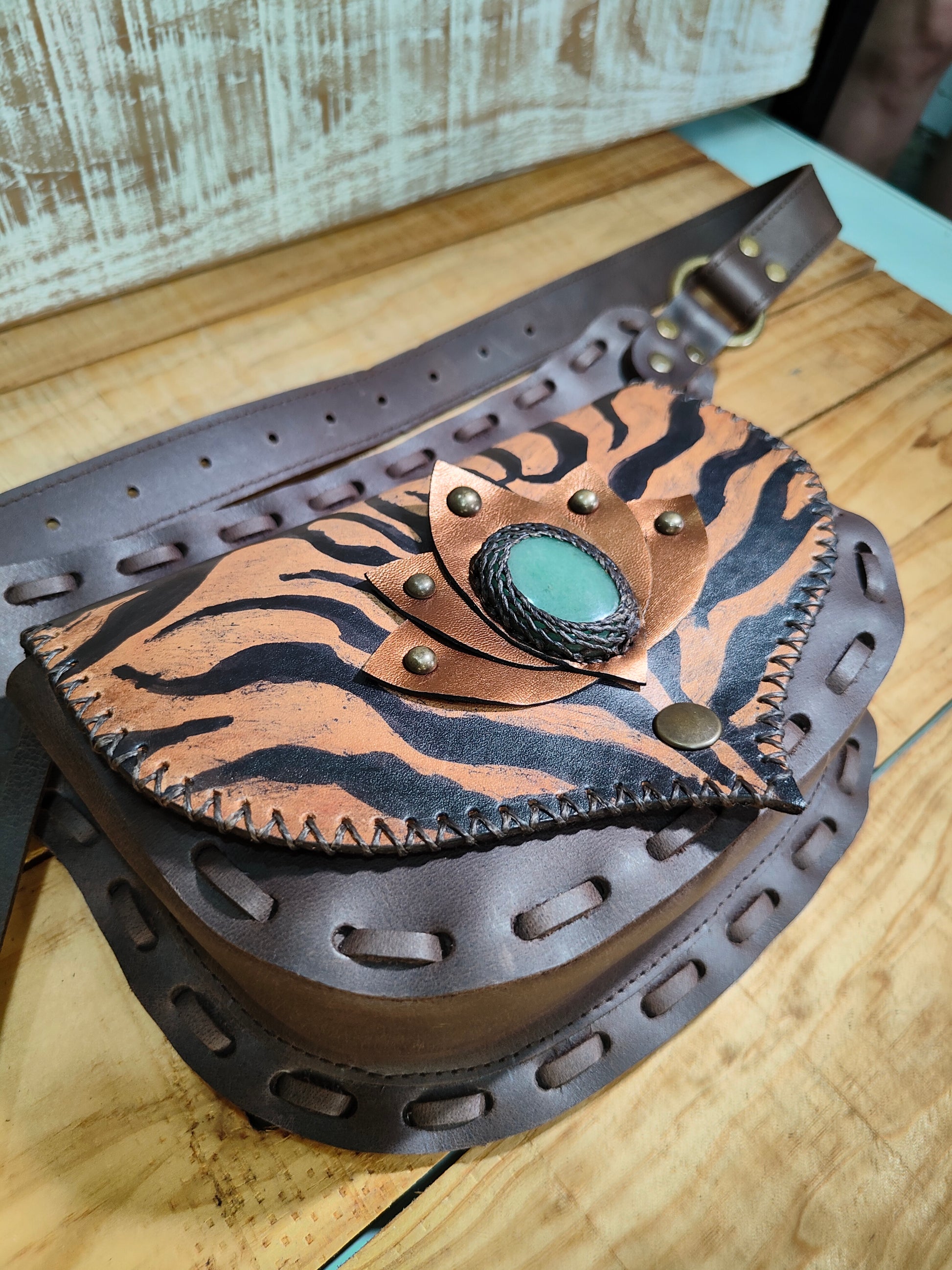 Hand-painted tiger motif on a Bohonito brown leather belt bag featuring a natural aventurine stone.