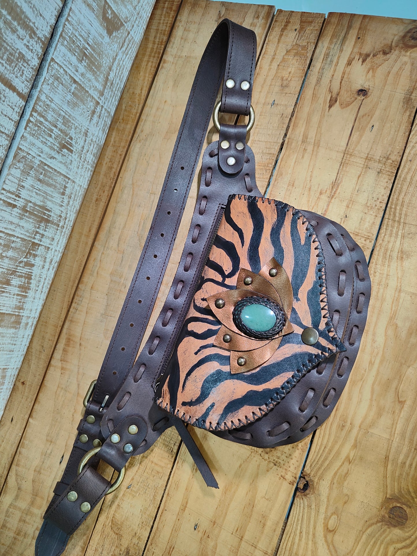 Bohonito belt bag in premium buffalo leather with a hand-painted tiger design and healing aventurine.