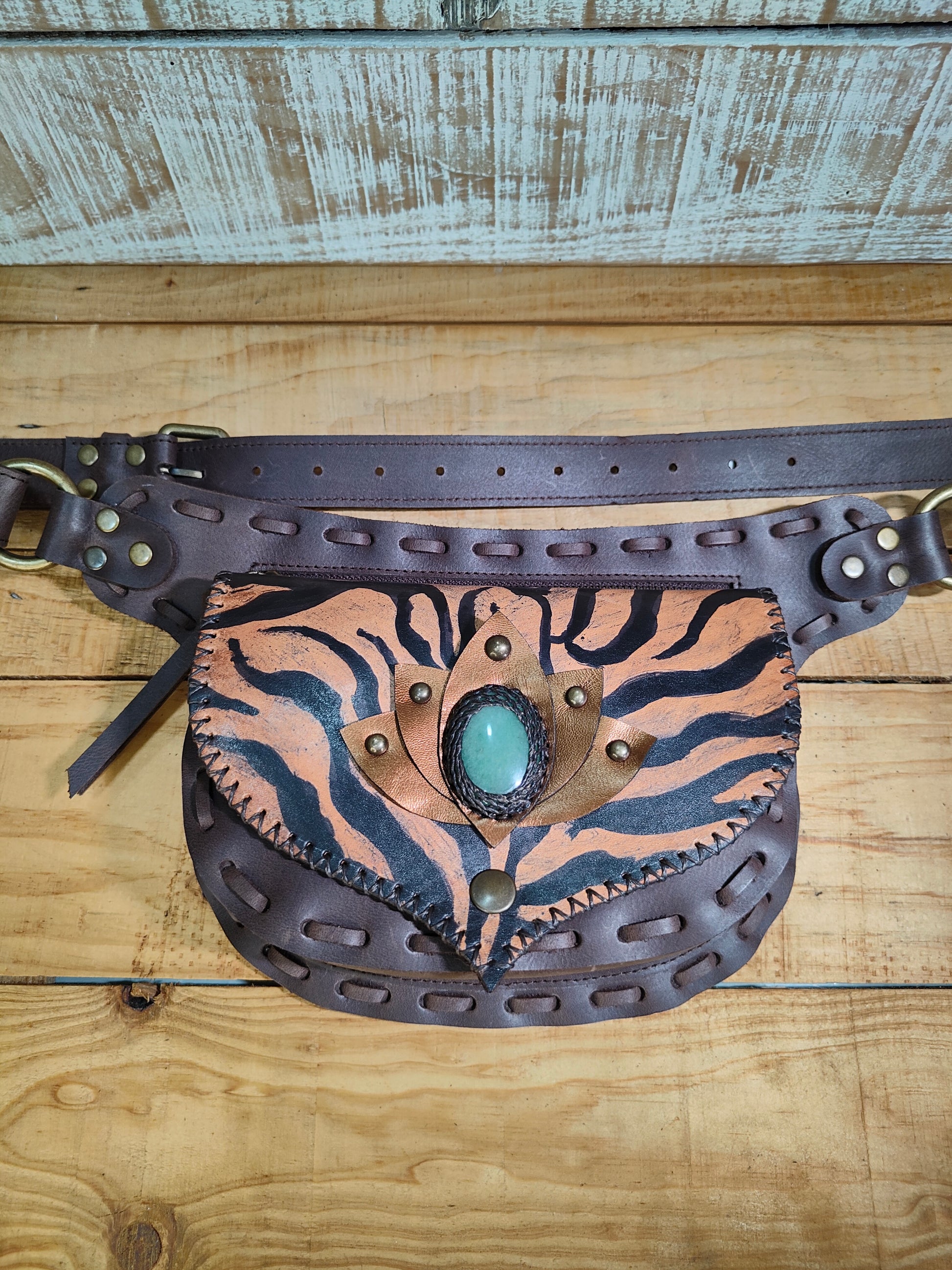 Hand-painted Tiger Lotto design on a Bohonito brown leather belt bag featuring a natural aventurine stone.