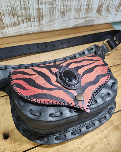 Versatile Bohonito waist bag in black leather featuring a hand-painted Red Tiger flap with Obsidian stone and adjustable strap.