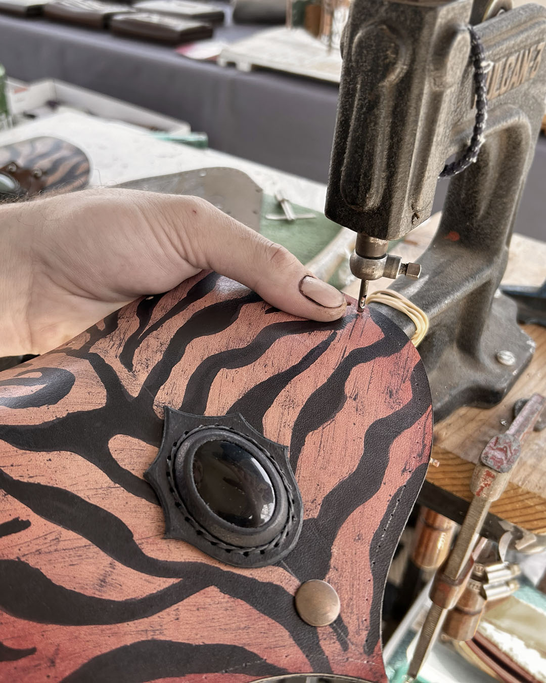Premium black sprinter leather belt bag by Bohonito featuring a resistant finish and unique hand-painted tiger art with protective obsidian gemstone.